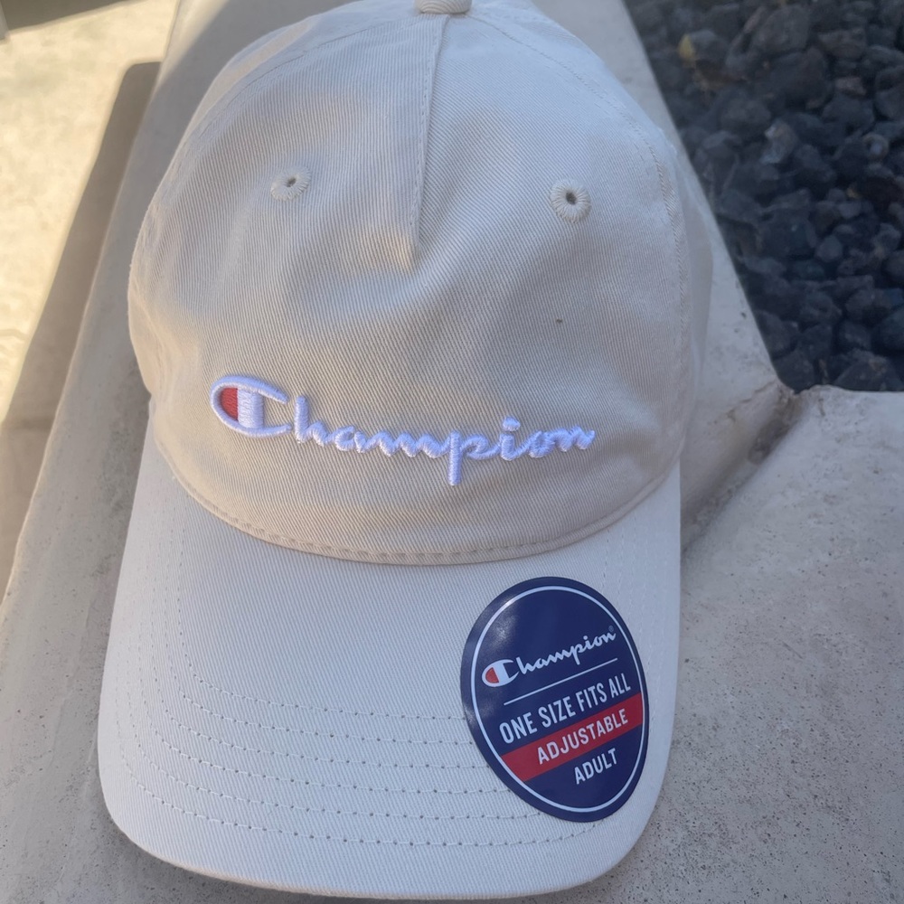 NWT Champion women’s hat color tan. Brand new never worn.
